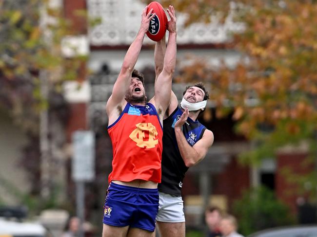 VAFA: Fitzroy’s Daniel Megennis and Uni Blacks’ Jesse Hare. Picture: Andy Brownbill