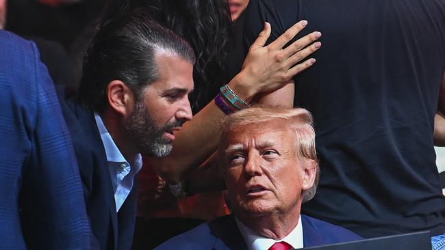 Donald Trump and his son Donald Trump Jr. attend the Ultimate Fighting Championship (UFC) mixed martial arts event in Miami. Picture: AFP.