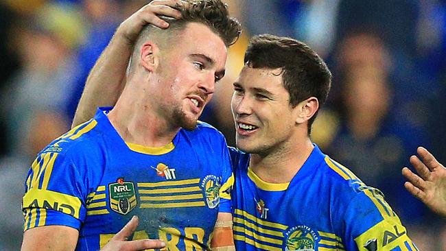 Clint Gutherson celebrates an Eels win with Mitchell Moses.