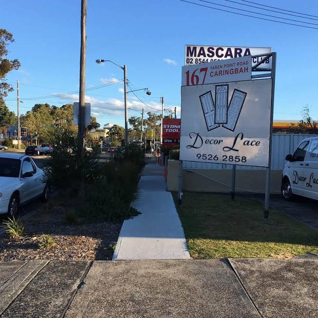 Signs for the Mascara Club visible from the street.