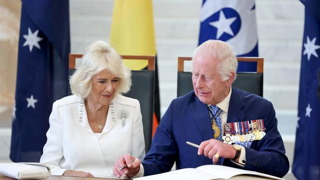 King Charles III and Queen Camilla sign Visitor’s books at the Australian Parliament House on October 21, 2024 in Canberra, Australia. Picture: Chris Jackson/Getty Images
