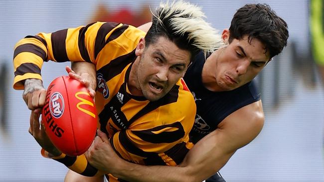 Chad Wingard is crunched in a tackle by the Blues Adam Cerra. Picture: AFL Photos/Getty Images