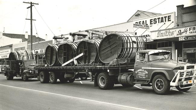 A set of 1000 gallon barrels block the main street of Stanthorpe. The arrival of the barrels in 1971 announced to the world that Angelo Puglisi had arrived. Photo supplied.