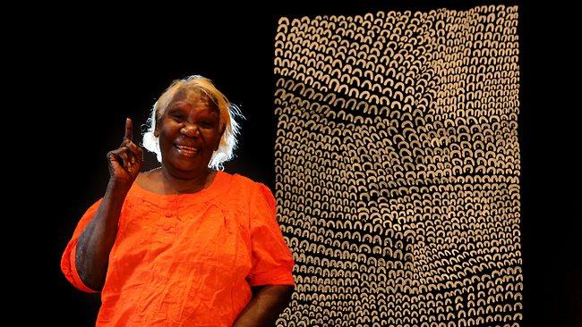 Lena Nyadbi with her work "Dayiwul Lirlmim" (Barramundi Scales)