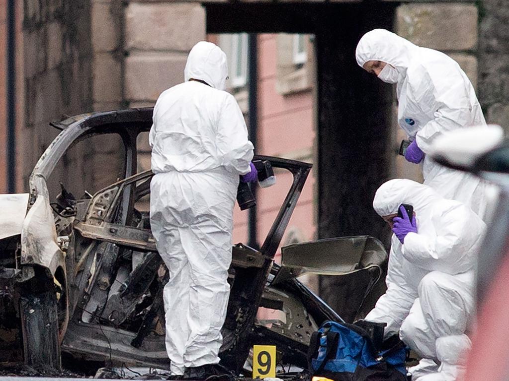 Police inspect a car that was allegedly used in a bombing in Northern Ireland. Picture: AFP