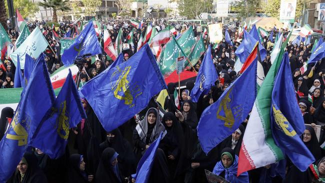 Iranians wave flags during a celebration following Iran's missiles and drones attack on Israel, on April 15 2024. Picture: Atta Kenare / AFP