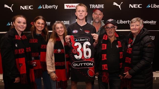 Angus Clarke with his family ahead of debut for Essendon against Richmond at the Melbourne Cricket Ground. Picture: by James Wiltshire/AFL Photos via Getty Images