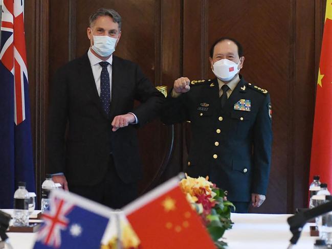 Richard Marles and China's Defence Minister Wei Fenghe pose for a photograph on the sidelines of the Shangri-La Dialogue summit in Singapore. Picture: AFP/Department of Defence