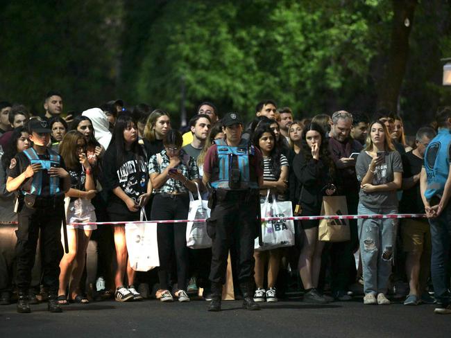 Fans wait near the hotel where he died in Buenos Aires. Picture: AFP