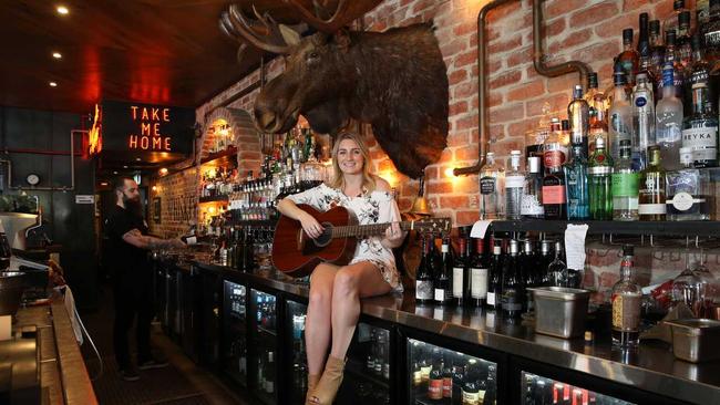 Brooke Lambert is a local artist who will be performing at Groundwater Country Music Festival at Broadbeach. Brooke and her guitar at The Loose Moose at Broadbeach. Picture: Glenn Hampson