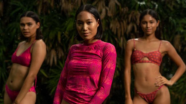 Nyasha Ogden, Ploy Deenan and Chyna Mayo preview the Indigenous fashion show to be held at George Brown Darwin Botanic Gardens tonight. Picture: Che Chorley