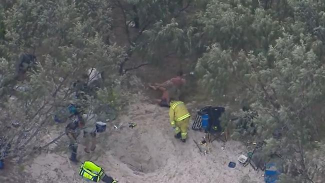 Fifteen men were used to pull him free from the hole. Picture: Nine News