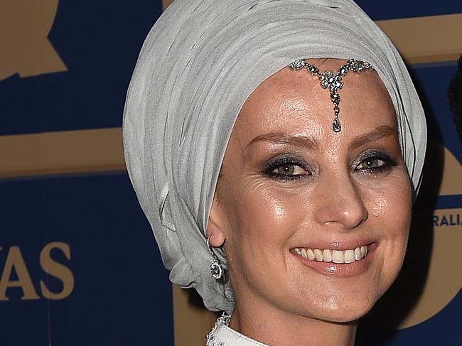 Television presenter Waleed Aly and wife Susan Carland arrive at the GQ Men of the Year awards, in Sydney, Tuesday, Nov. 10, 2015. (AAP Image/Dan Himbrechts) NO ARCHIVING