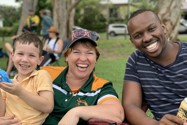 Getting into the spirit are (from left) Oli Duncan, 5, Rose Duncan and Ernest Maina, of Mackay, at the Mackay Rugby Union Anzac Day clash at Cathy Freeman Oval in Slade Point. Saturday, April 23, 2022. Picture: Tara Miko