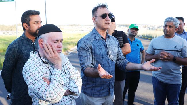 Some of the victims of the Qartaba Homes collapse at one of the company's vacant sites in Box Hill, northwest Sydney. Picture: John Feder