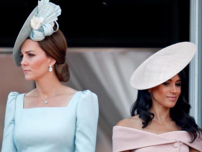 Kate Middleton and Meghan Markle in what appears as a tense moment.