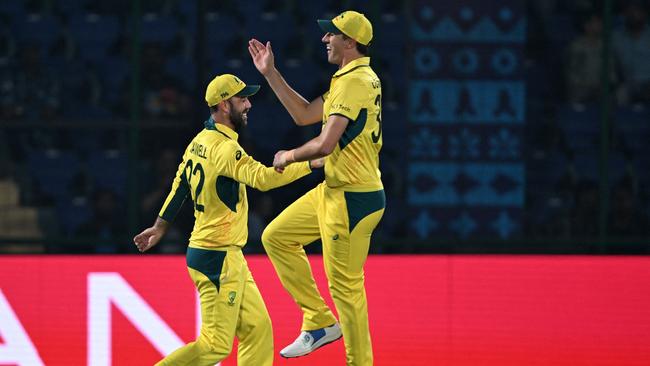 Glenn Maxwell – pictured with Aussie skipper Pat Cummins – is the ultimate entertainer. Photo by Arun Sankar/AFP