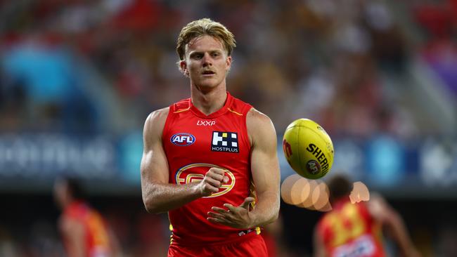 GOLD COAST, AUSTRALIA – APRIL 13: Bodhi Uwland of the Suns warms up during the round five AFL match between Gold Coast Suns and Hawthorn Hawks at People First Stadium, on April 13, 2024, in Gold Coast, Australia. (Photo by Chris Hyde/Getty Images)