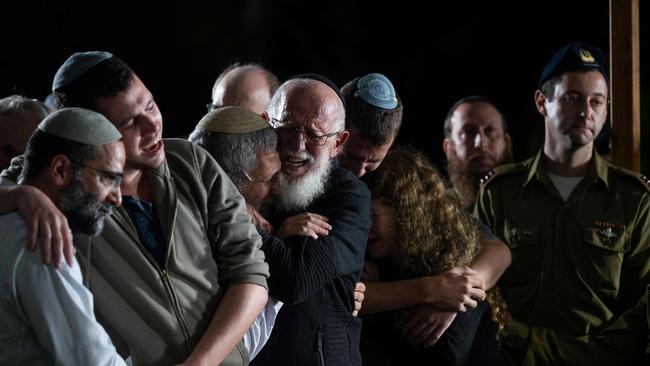 Relatives and friends of Israeli army soldier Ameti Zvi Garnot mourn during his funeral in Jerusalem on Monday. Picture: AFP