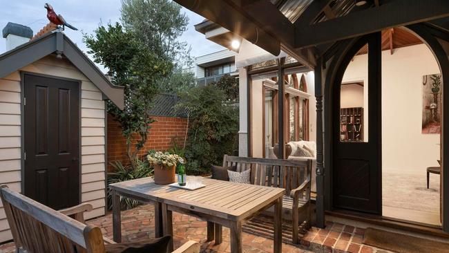 A covered patio, concealed commercial-grade outdoor kitchen, storeroom and two garden sheds are also on offer.