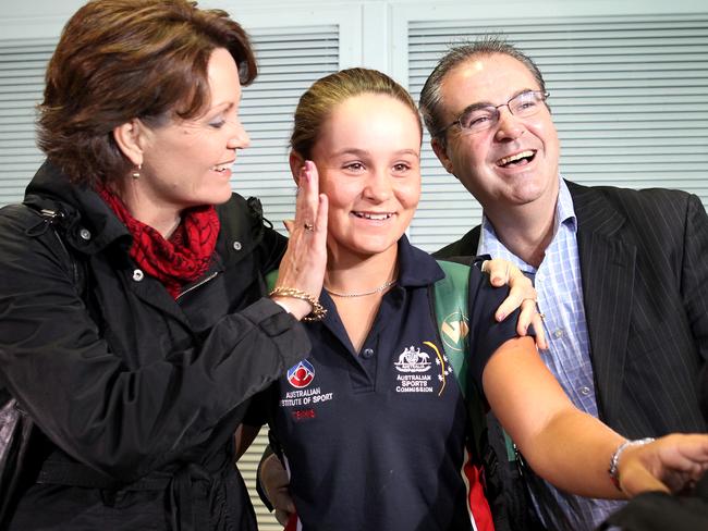 Ashleigh Barty when she was just 15 with her proud Mum and Dad Josie and Robert at the airport. Picture: Tim Marsden