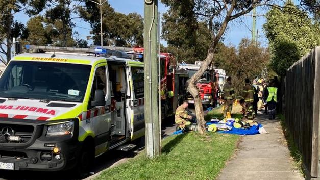 Firefighters donned breathing apparatus to enter a building fire on Plenty Rd. Kingsbury and save two occupants. Picture: Odessa Blain