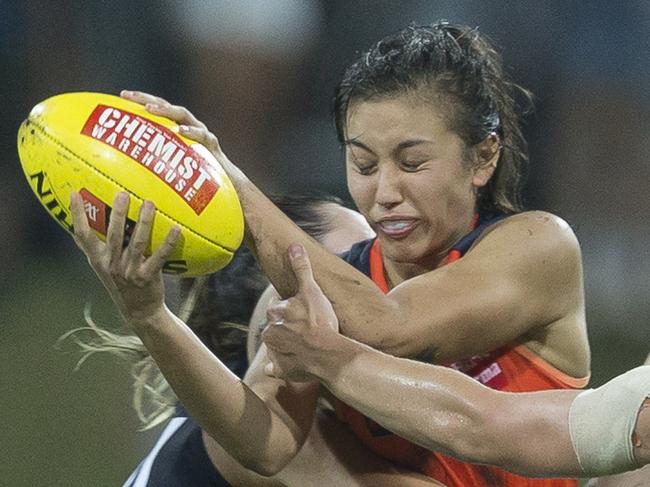 Rebecca Beeson of the Giants is tackled during the Round 2 AFLW match between the Greater Western Sydney (GWS) Giants and the Carlton Blues at Drummoyne Oval in Sydney, Friday, February 9, 2018. (AAP Image/Craig Golding) NO ARCHIVING, EDITORIAL USE ONLY