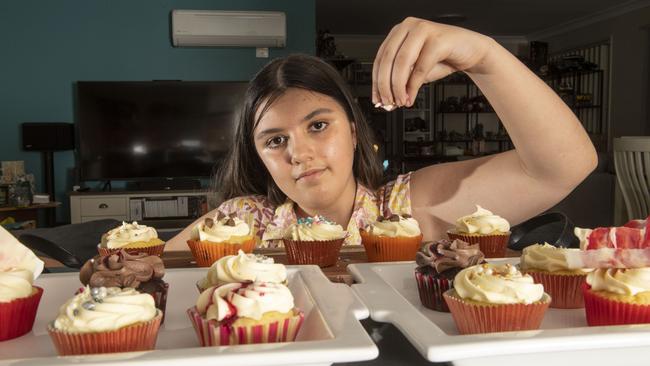 Katherine Preston makes yummy cupcakes for sale at the Cabarlah markets. Wednesday, November 10, 2021. Picture: Nev Madsen.