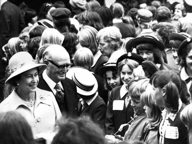 Meeting children at Government House in 1977.