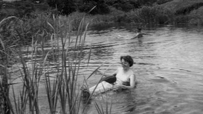 A woman cools off in Parramatta River near Speers Rd in 1954.