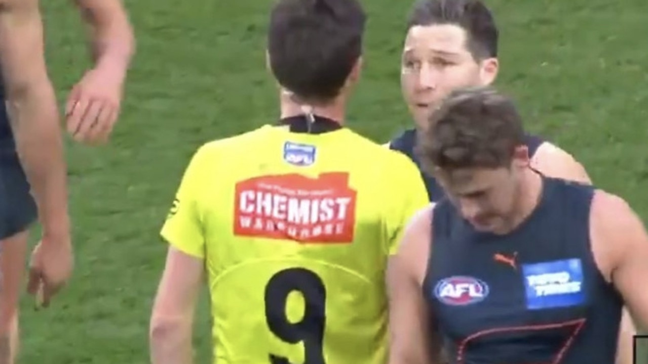 Moment Toby Greene makes contact with umpire Matt Stevic.