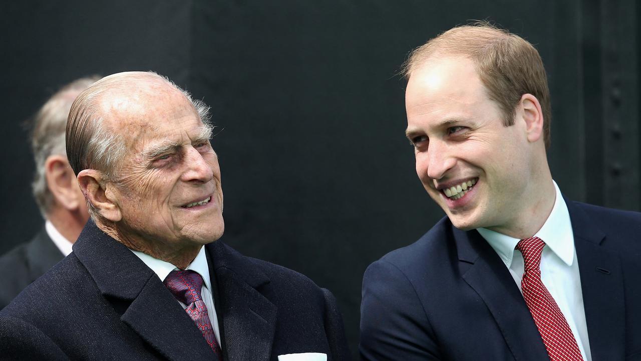 Prince Philip with his grandson Prince William. Picture: AFP