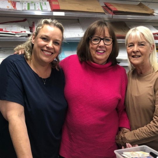 The owner of the Elanora Newsagency and Post Office, Karla Rothpletz-Tatt (centre) with staff members Sam Beard (left) and Lee Nourse, on Tuesday. Picture: Jim O’Rourke