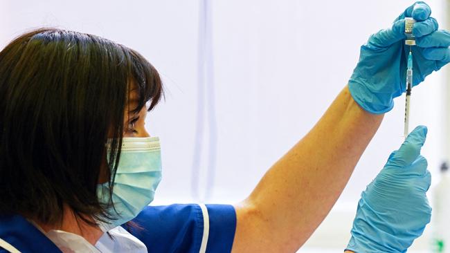 A nurse prepares a dose the Pfizer-BioNtech vaccine.