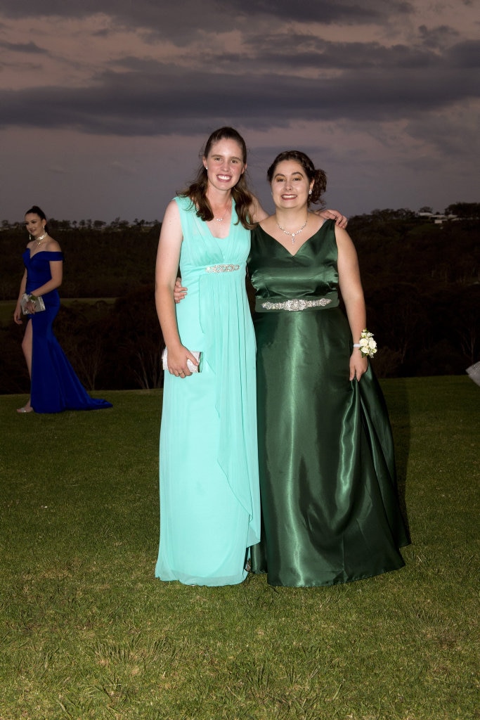 Laura Anderson (left) and Ashleigh Martin. The first group of Year 12 students to graduate from TACAP's held their formal at Preston Peak Winery. November 2018. Picture: Bev Lacey