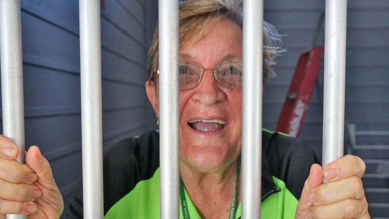 Sue Smith pleads her innocence from behind the bars of the old Sarina watch-house at the Sarina Arts and Crafts Centre.