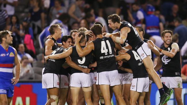 Carlton players celebrate on the final siren. Pic: Michael Klein.