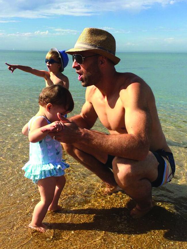 Chris with his kids at the beach.