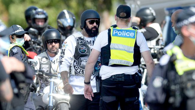 Police intercept members of the Nomads motorcycle gang as they leave their Laverton North clubhouse on Saturday. Picture: Andrew Henshaw