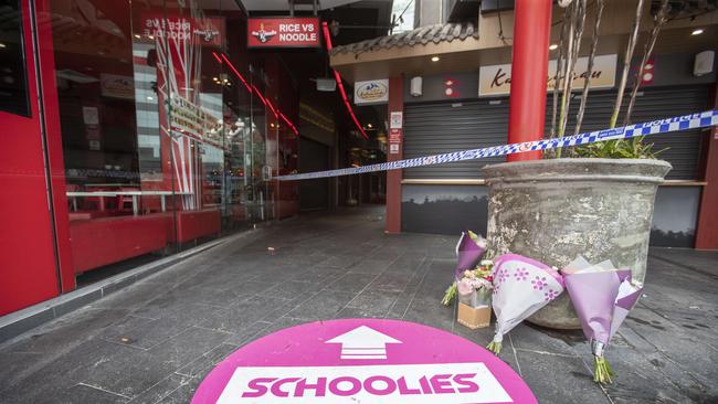 Flowers at the scene in Surfers Paradise where schoolie Charlie Scott fell to his death last week. Picture: Nigel Hallett.