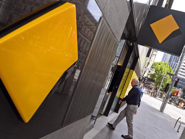 A man walks into a branch of the Commonwealth Bank in Melbourne on February 6, 2019. - Australia's largest financial firm Commonwealth Bank on February 6 said profits fell six percent in the last six months of 2018 amid a "challenging environment" for the business. (Photo by William WEST / AFP)