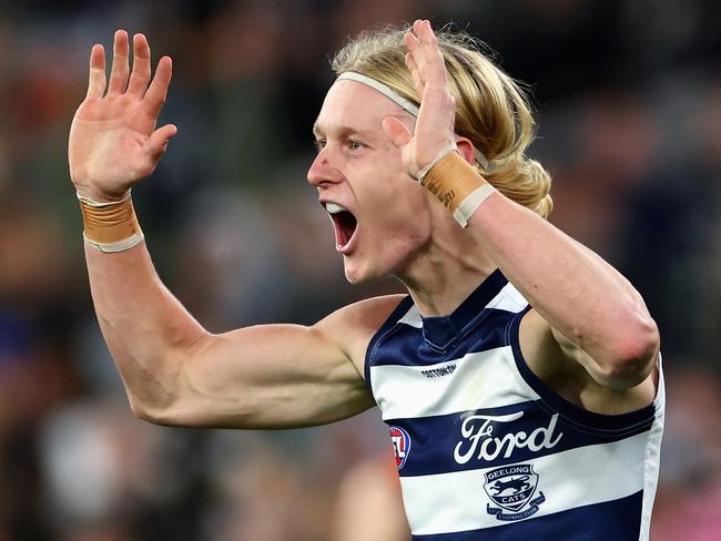 MELBOURNE, AUSTRALIA - JUNE 21: Oliver Dempsey of the Cats celebrates kicking a goal during the round 15 AFL match between Carlton Blues and Geelong Cats at Melbourne Cricket Ground, on June 21, 2024, in Melbourne, Australia. (Photo by Quinn Rooney/Getty Images)