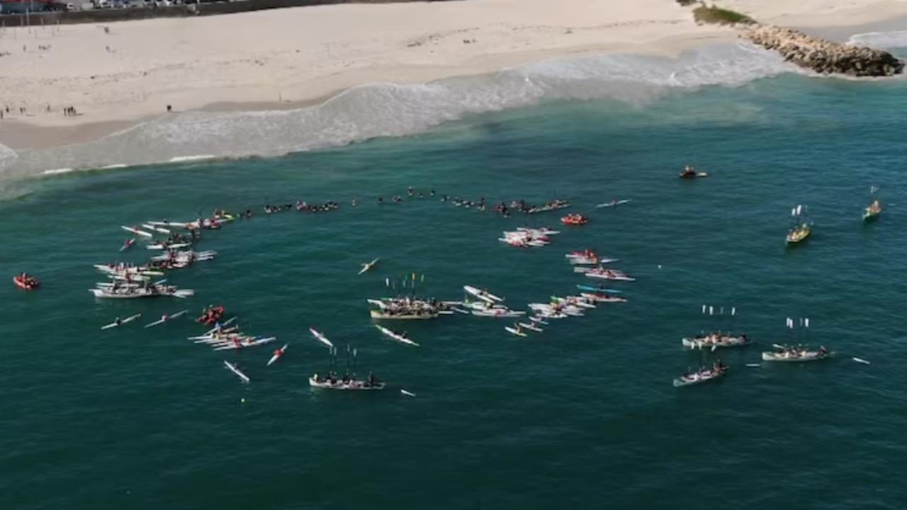 Members of the Perth community have paddled out off a beach in WA in memory of Jake and Callum Robinson, who were killed during a surfing trip in Mexico. Picture: Supplied.