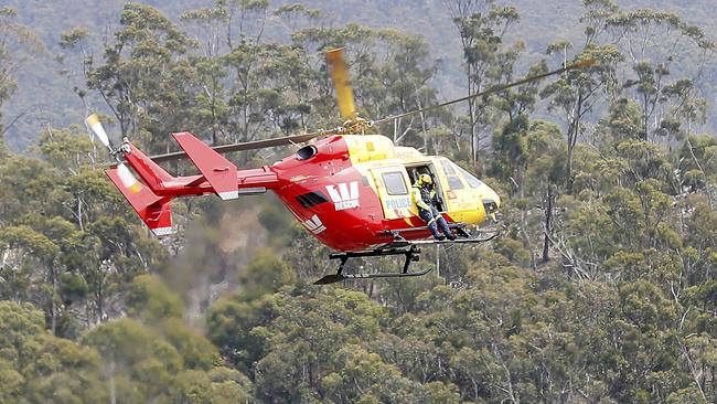 Two police rescue helicopter attended the scene and with the assistance of local paramedics and a doctor the male was stabilised before being flown to RHH. Picture: RICHARD JUPE