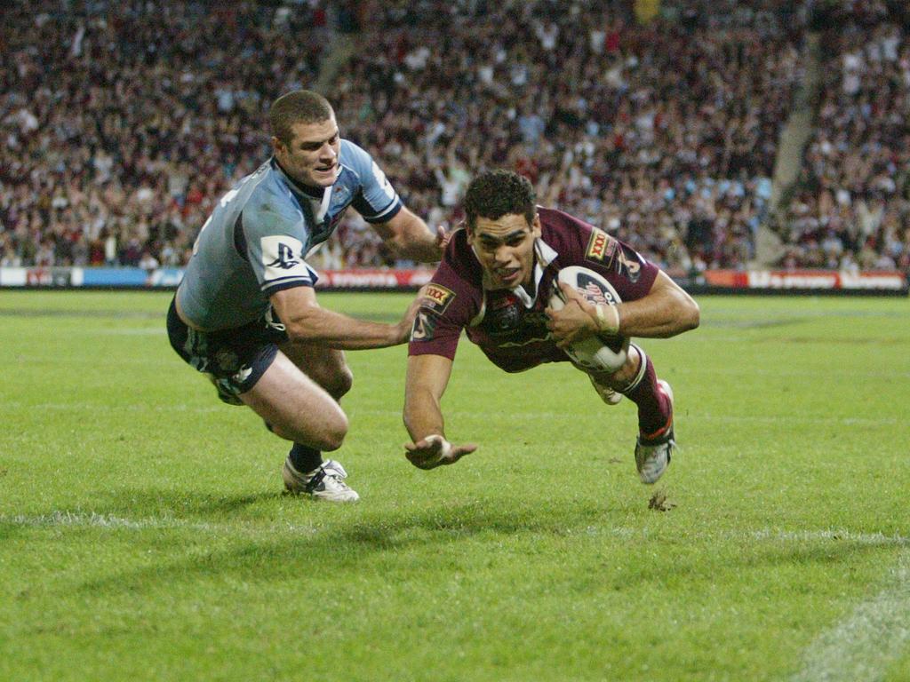 Greg Inglis scores a try.