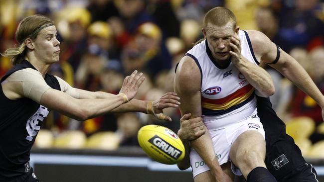 Sam Jacobs of the Crows is tackled during the Round 23 match against Carlton. Picture: AAP Image/Daniel Pockett