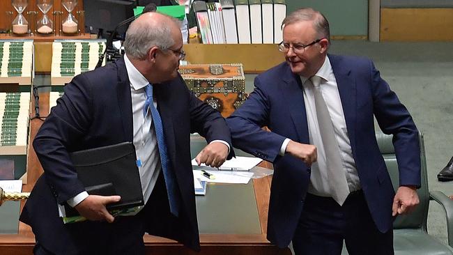 Prime Minister Scott Morrison and Opposition Leader Anthony Albanese bump elbows at the conclusion of Question Time in the House of Representatives at Parliament House earlier this month. Picture: Getty Images