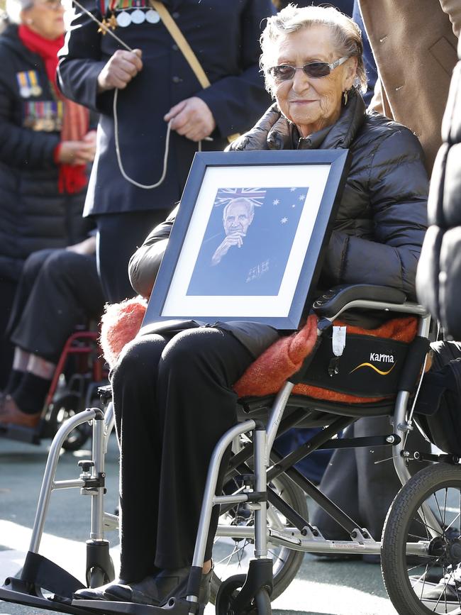 Flora Yeomans 91, holds a photo of her late husband Albert, who fought in Bougainville. Picture: David Caird