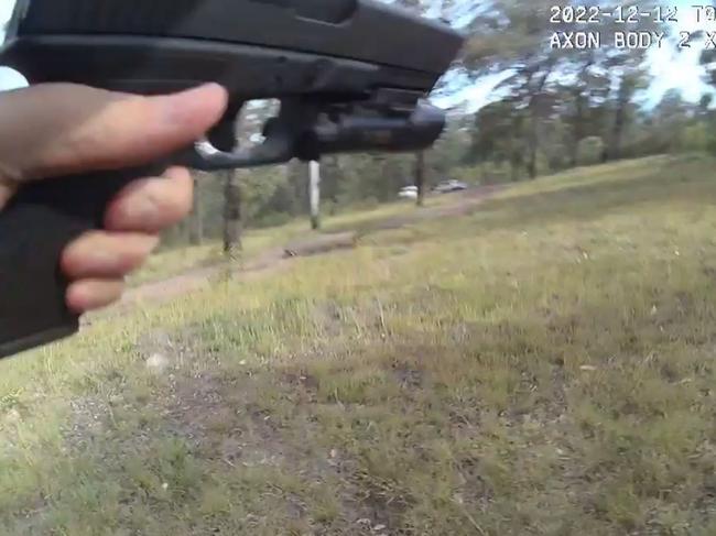 Still from Randall Kirk's body camera running from the Train's Wieambilla property while being shot at.