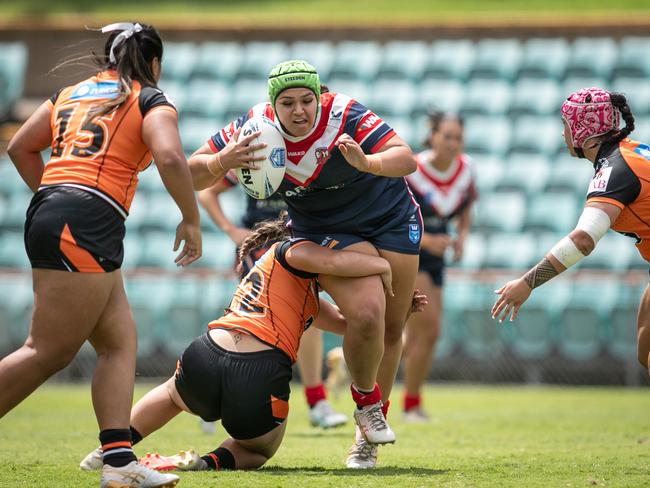 Moanalei Brown charges through a tackle. Picture: Julian Andrews